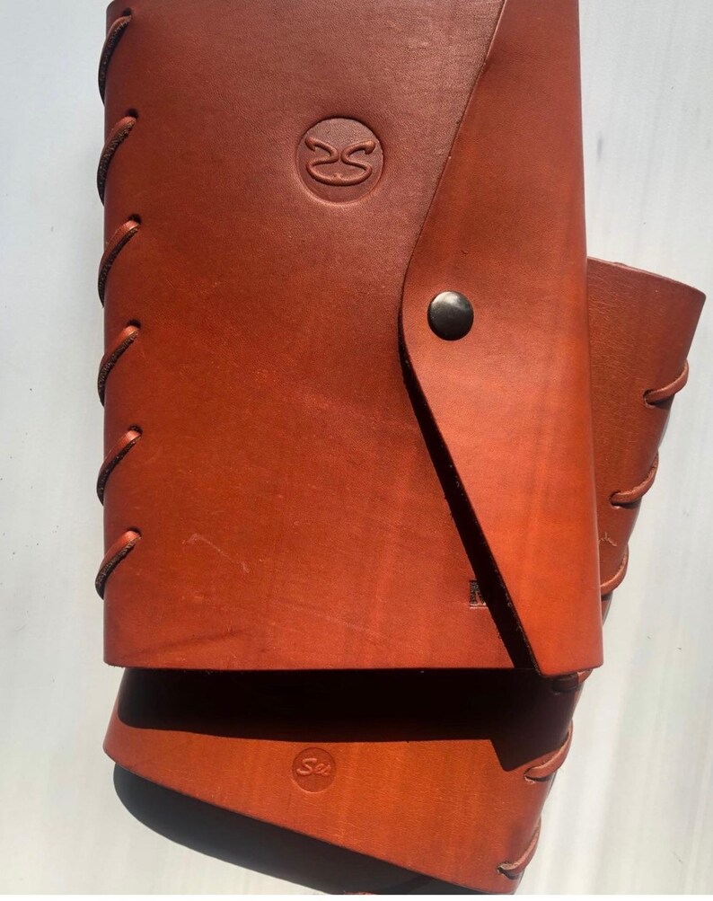 Tan leather wrap journals with side lacing and snap closure